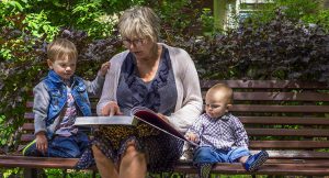 Resort Sitter on Bench with kids